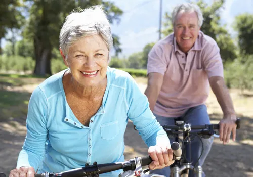 Chiropractic Jacksonville FL Elderly Couple Riding Bikes